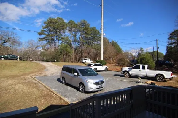 a view of a patio with iron fence