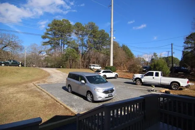 a view of a patio with iron fence