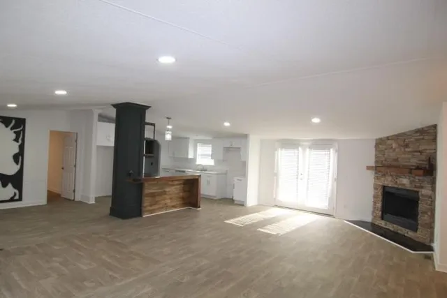 a view of a kitchen and refrigerator in a room