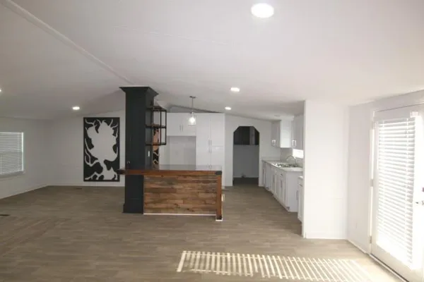 a view of an empty room and a window