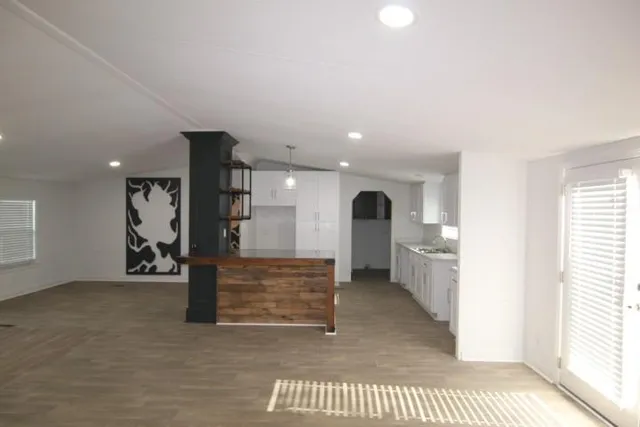 a view of an empty room and a window