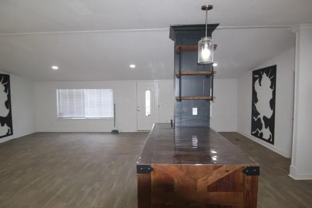 a view of a livingroom with furniture and wooden floor