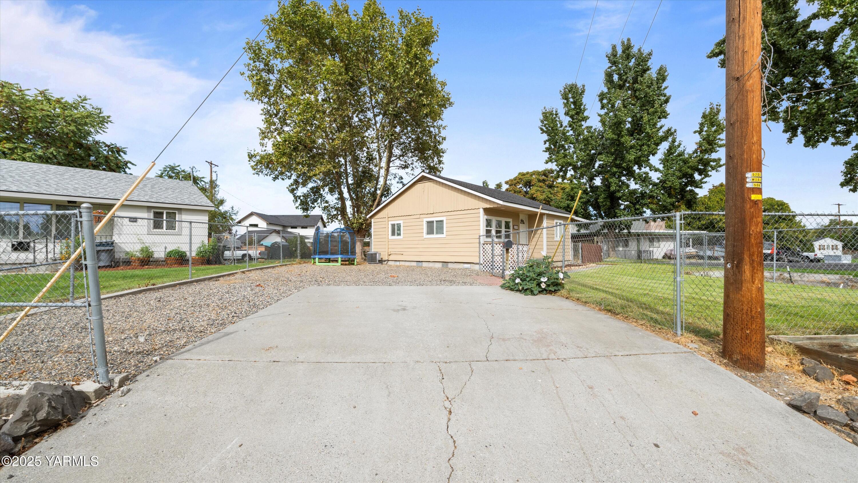 1802 Symons Street Richland, WA 99354 - Photo 13 of 23 a house with trees in front of it
