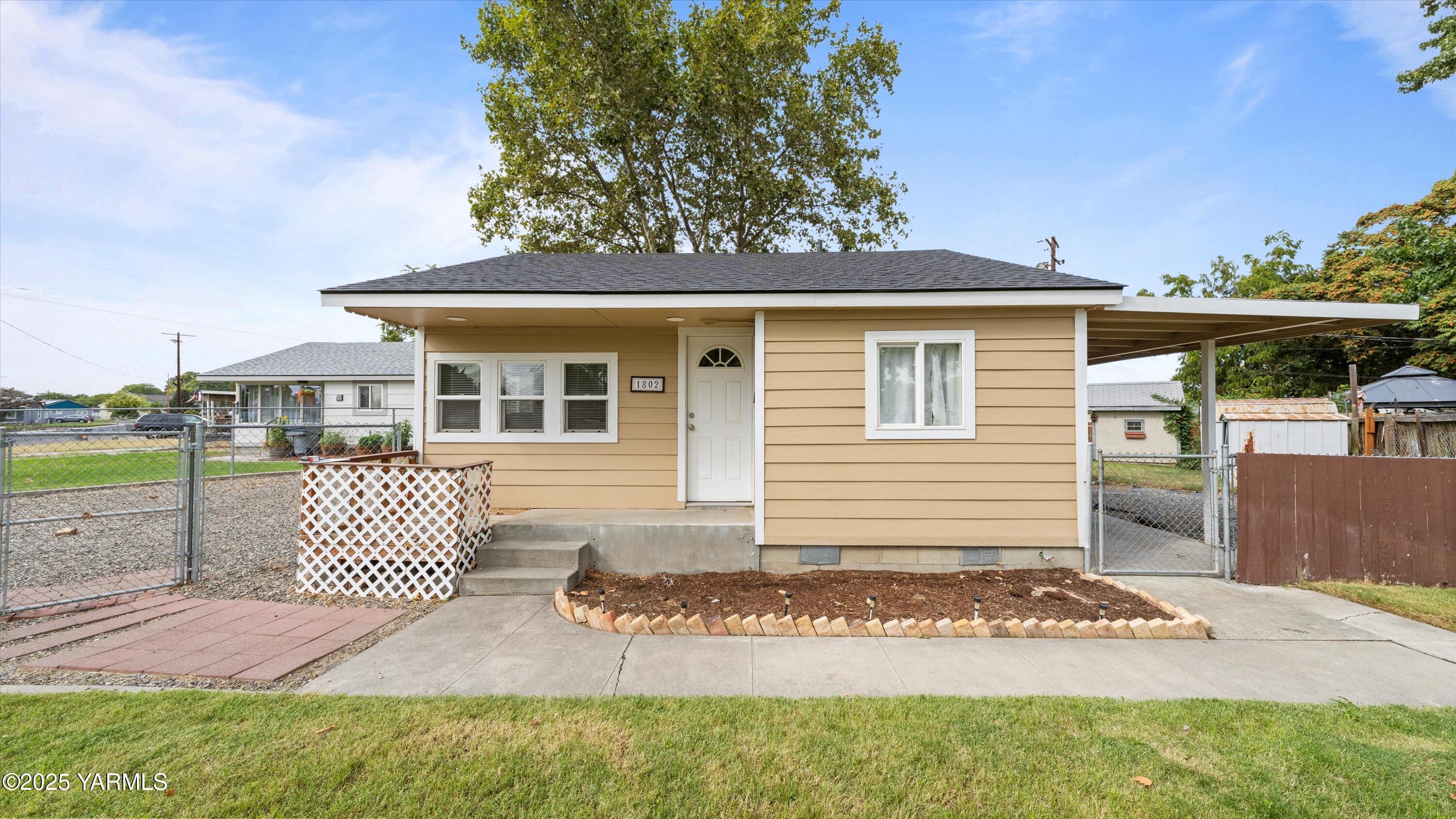 1802 Symons Street Richland, WA 99354 - Photo 16 of 23 a front view of a house with a garden