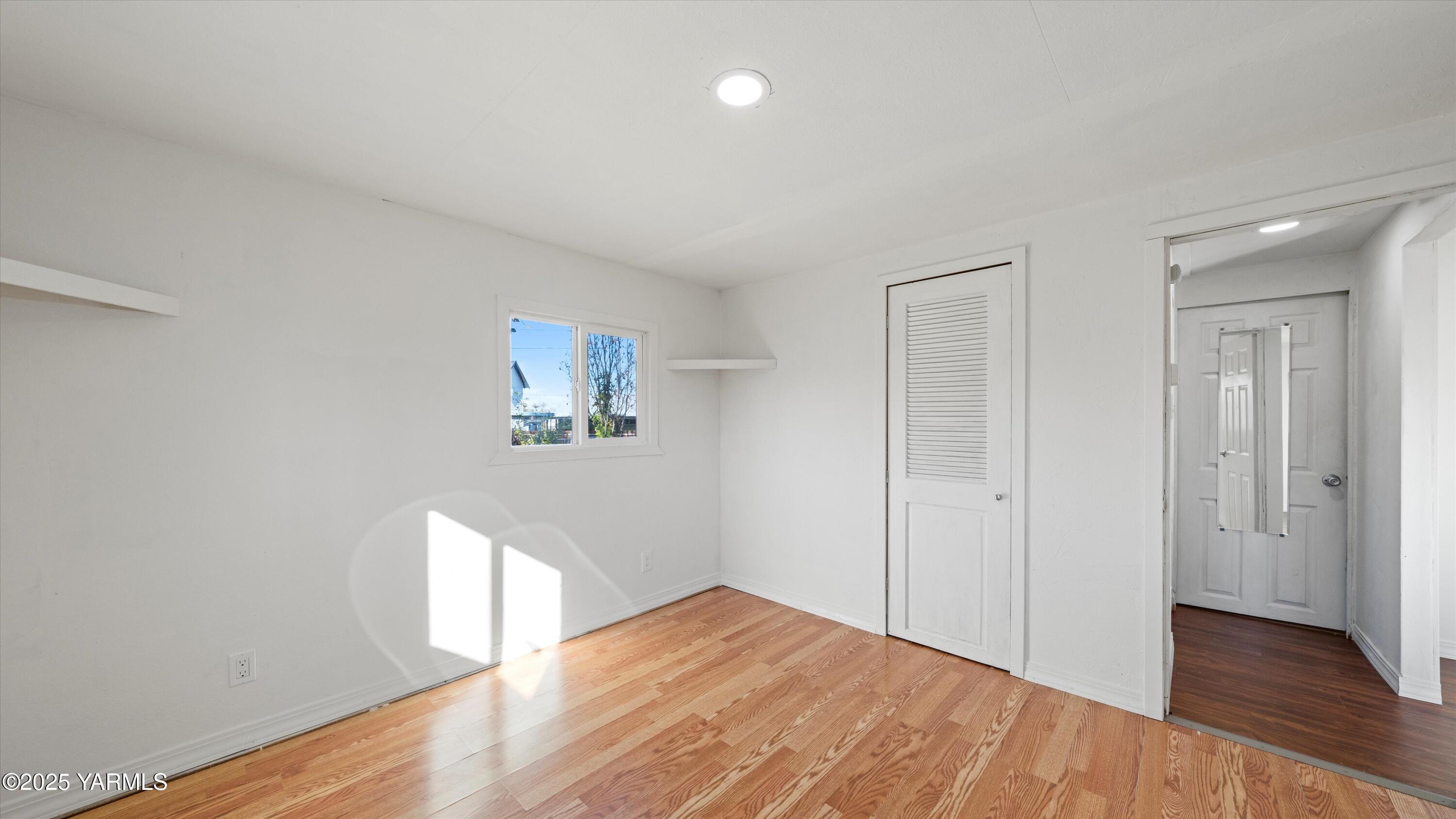 1802 Symons Street Richland, WA 99354 - Photo 2 of 23 a view of empty room with wooden floor