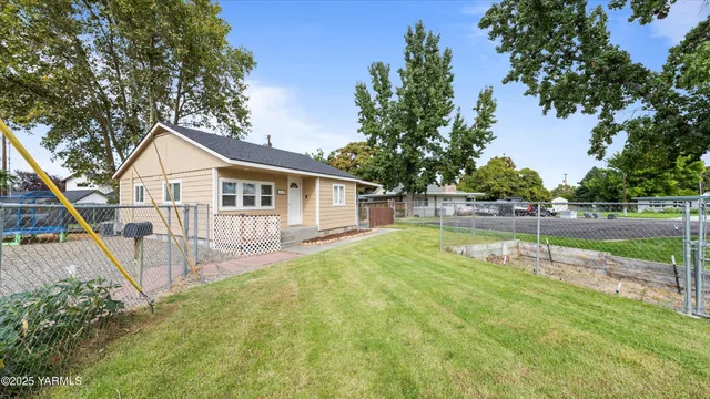 a view of a house with pool and a big yard