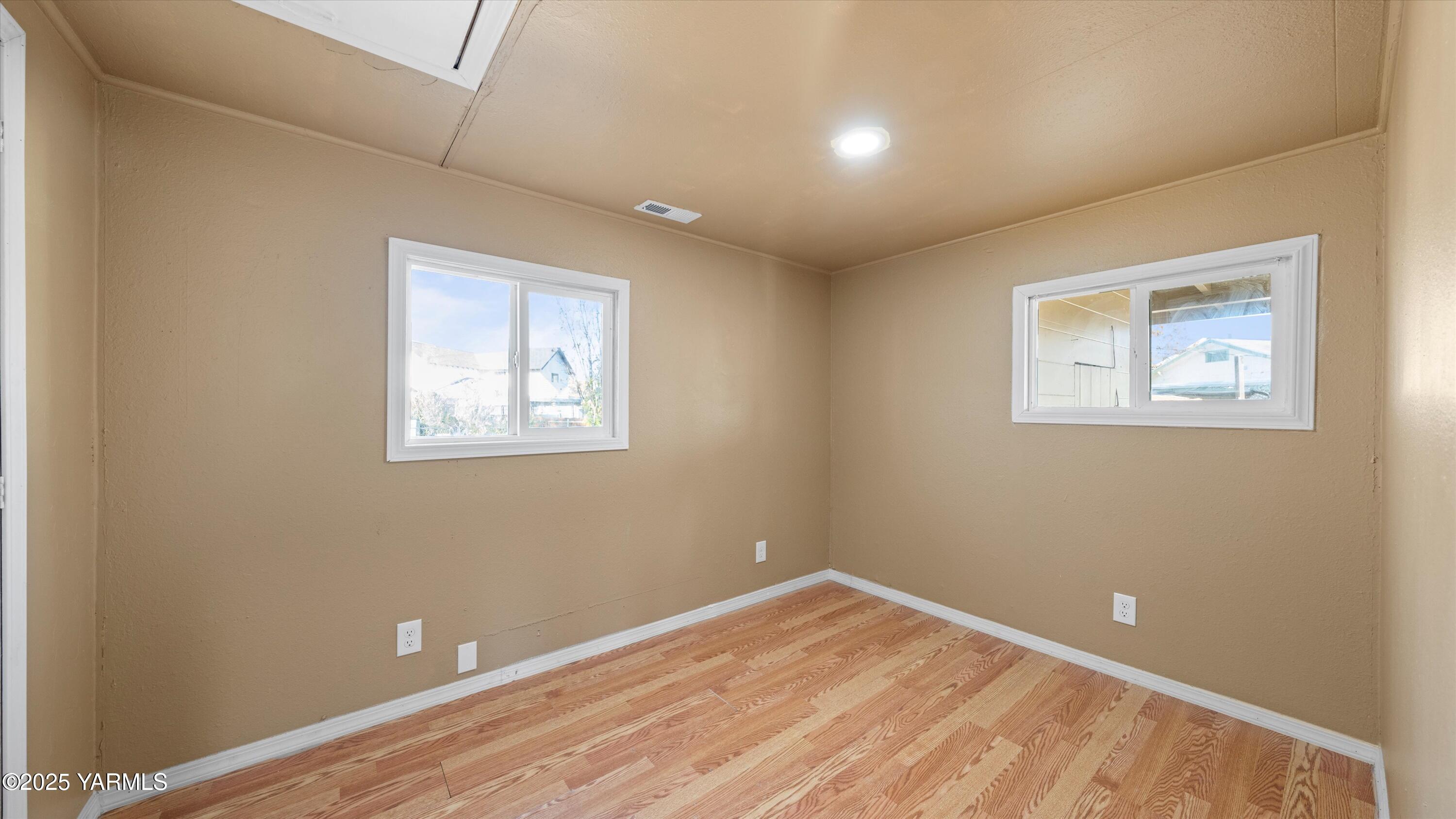 1802 Symons Street Richland, WA 99354 - Photo 3 of 23 a view of empty room with wooden floor