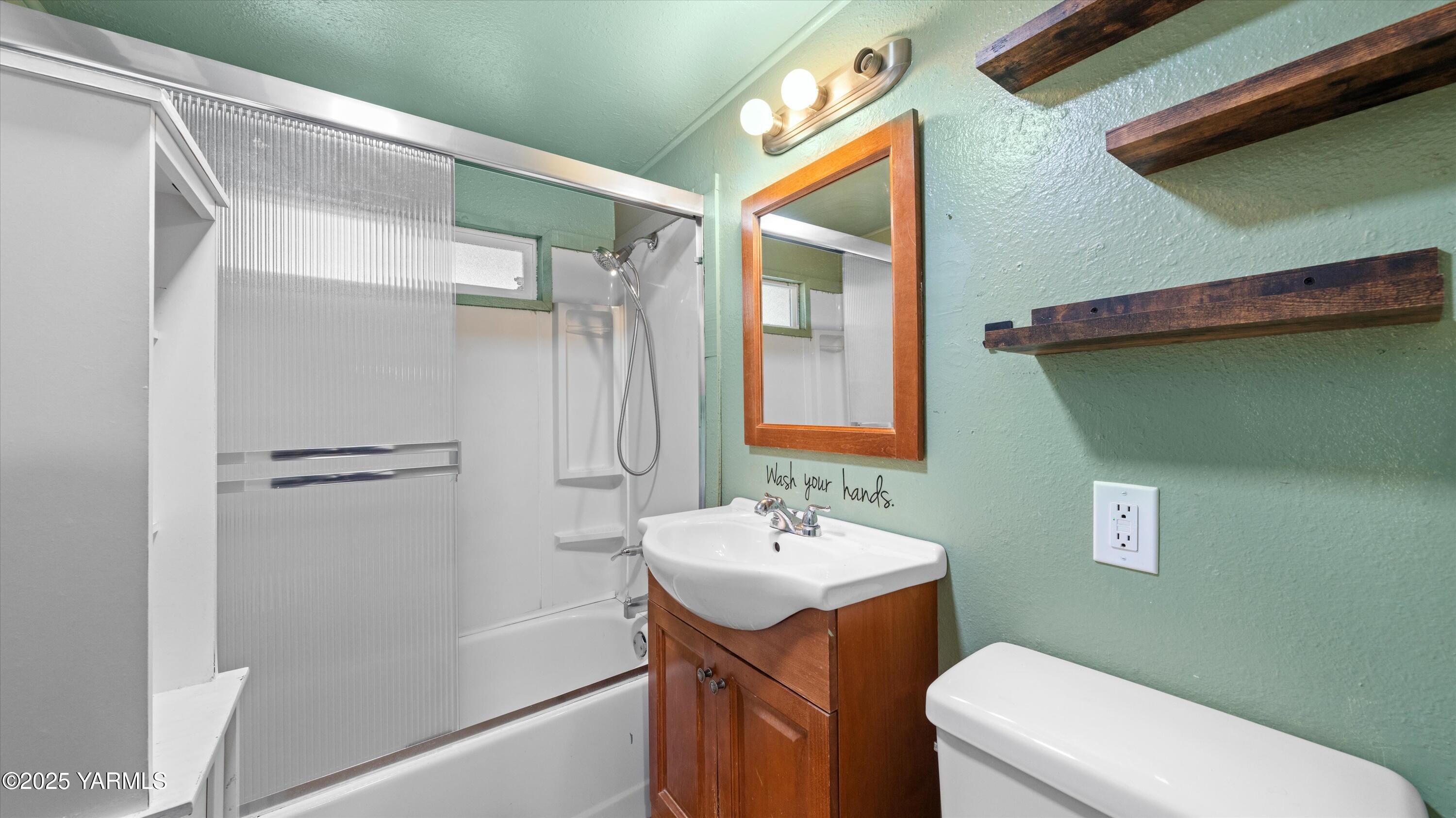 1802 Symons Street Richland, WA 99354 - Photo 5 of 23 a bathroom with a sink a toilet and shower