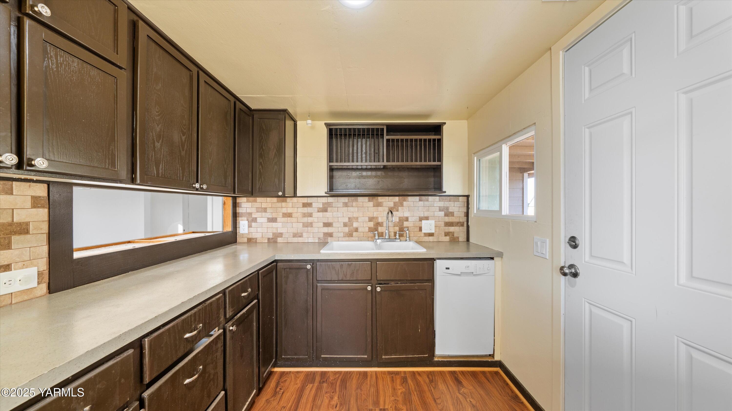 1802 Symons Street Richland, WA 99354 - Photo 8 of 23 a kitchen with a sink and cabinets
