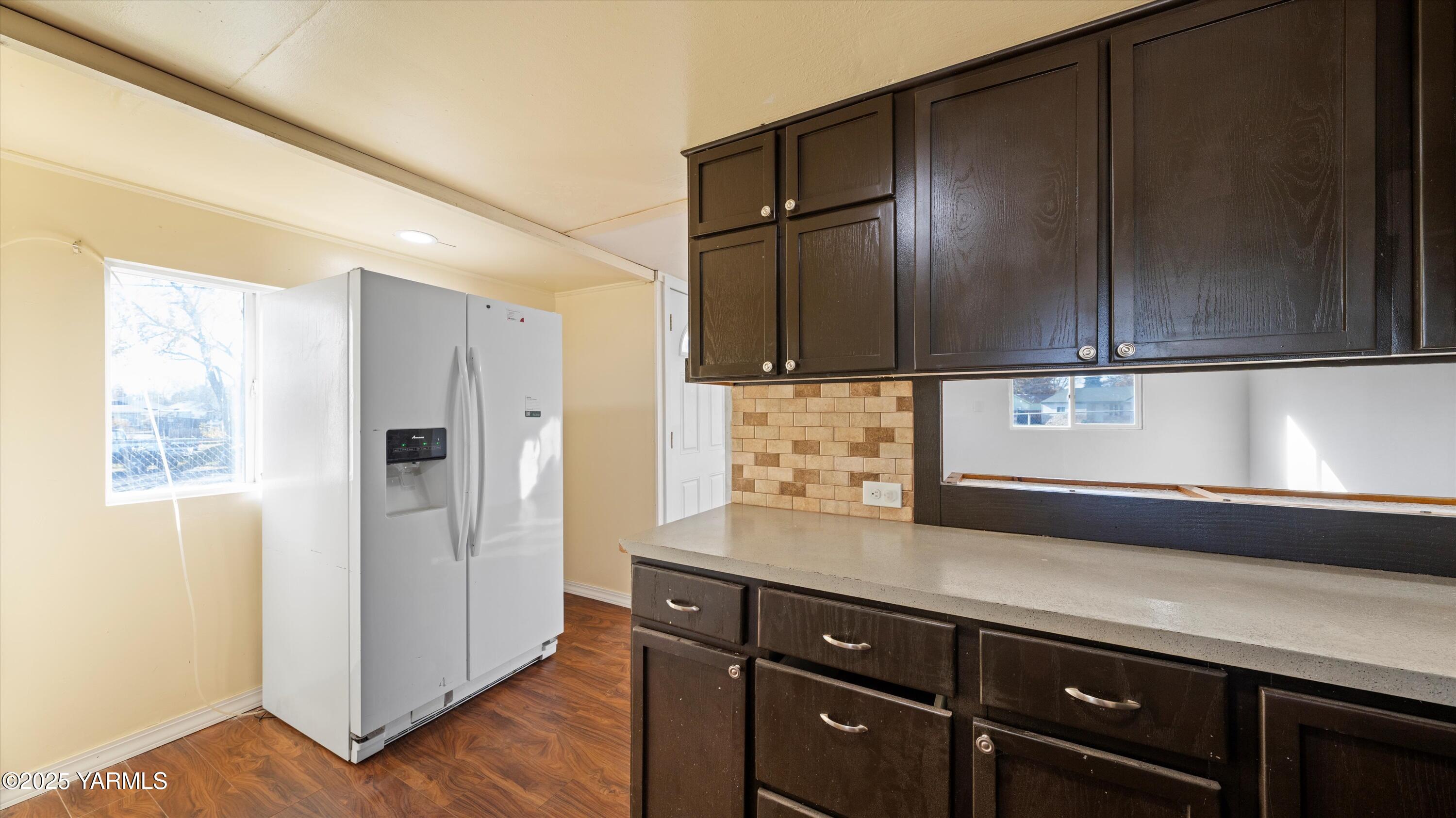 1802 Symons Street Richland, WA 99354 - Photo 10 of 23 a kitchen with a refrigerator and a sink