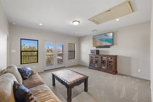 a bed room with a bed and a chandelier