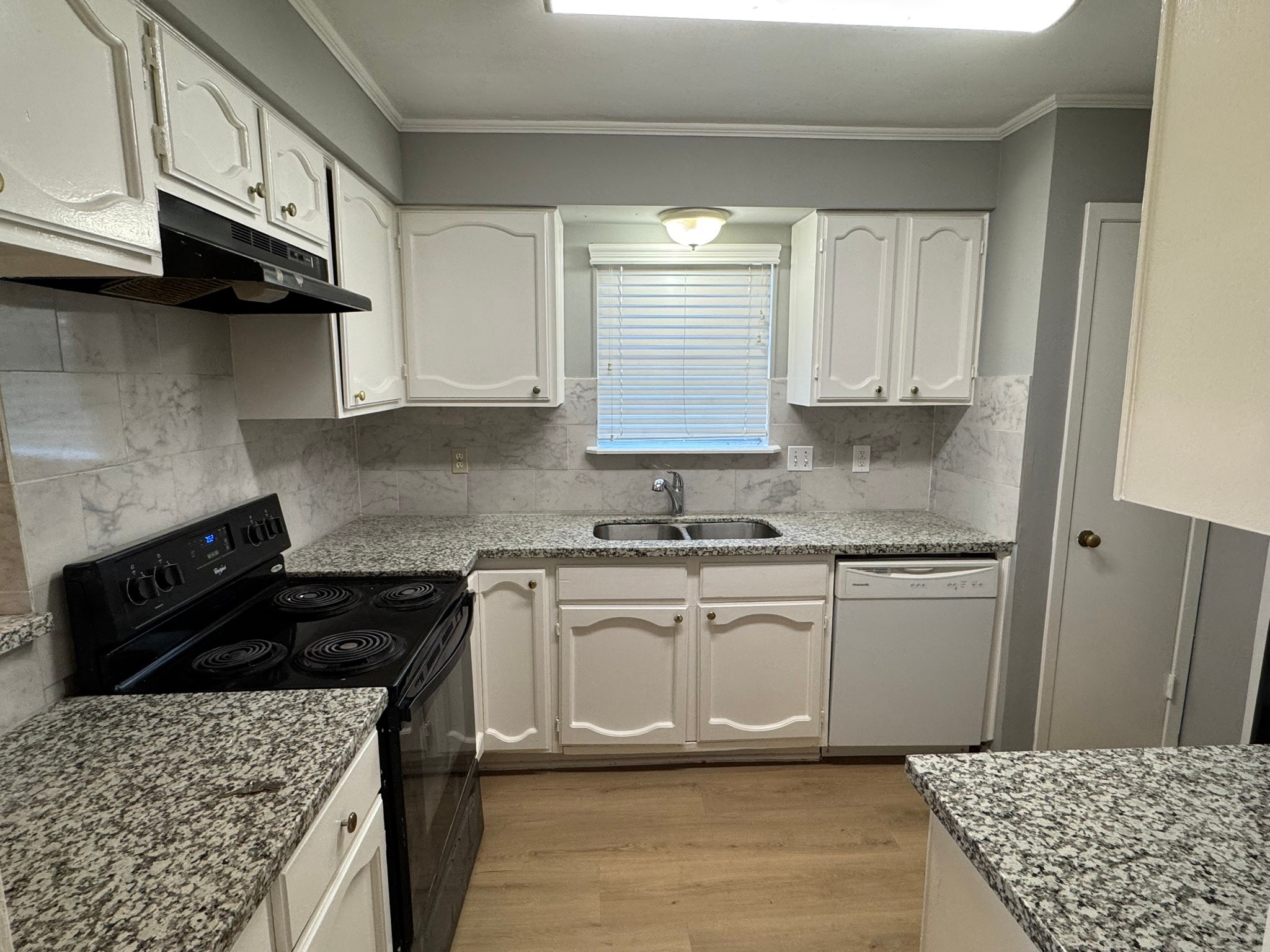 7231 Daylight Lane Houston, TX 77095 - Photo 2 of 11 a kitchen with stainless steel appliances granite countertop a sink stove and cabinets