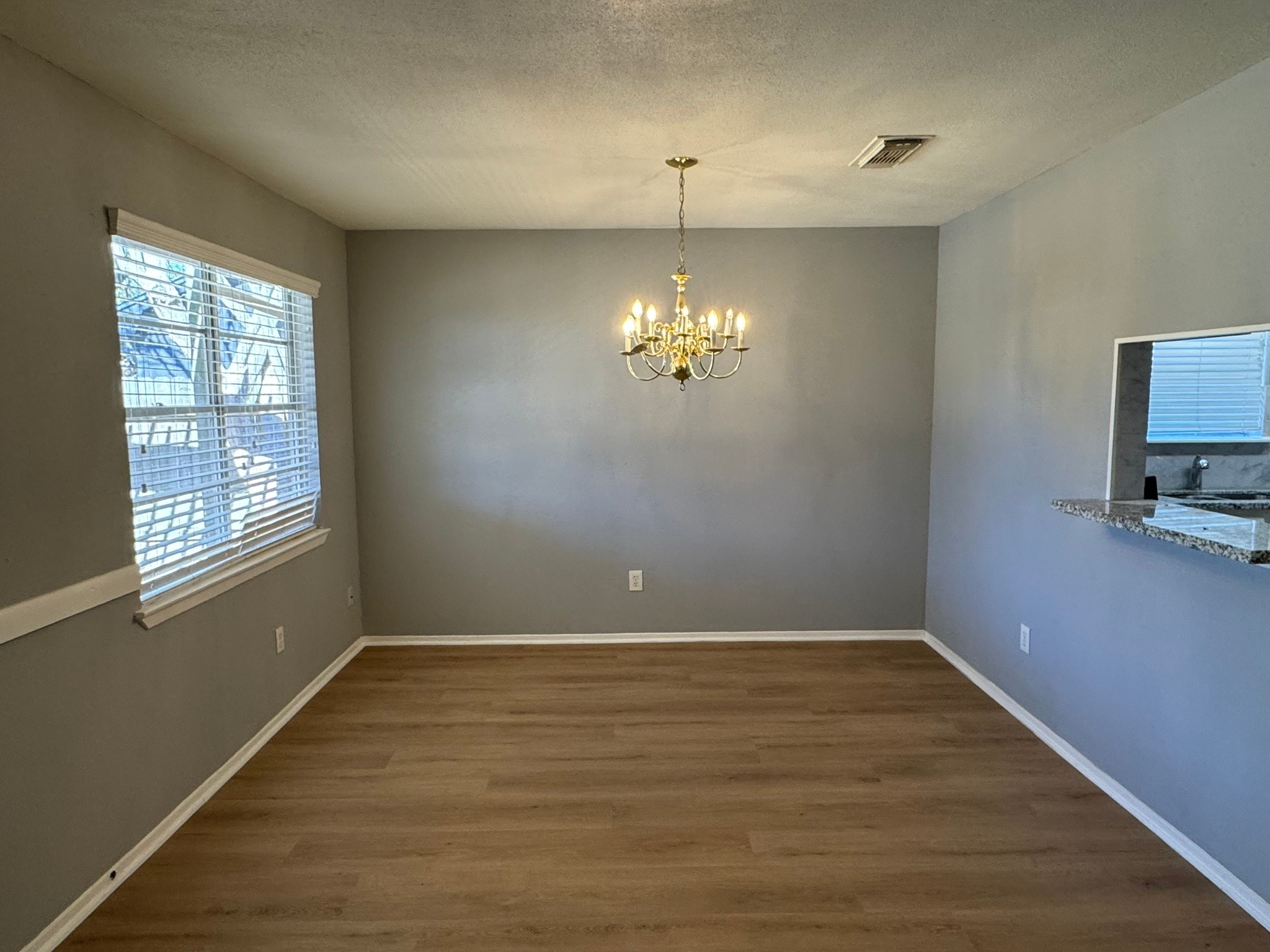 7231 Daylight Lane Houston, TX 77095 - Photo 5 of 11 wooden floor in an empty room with a window