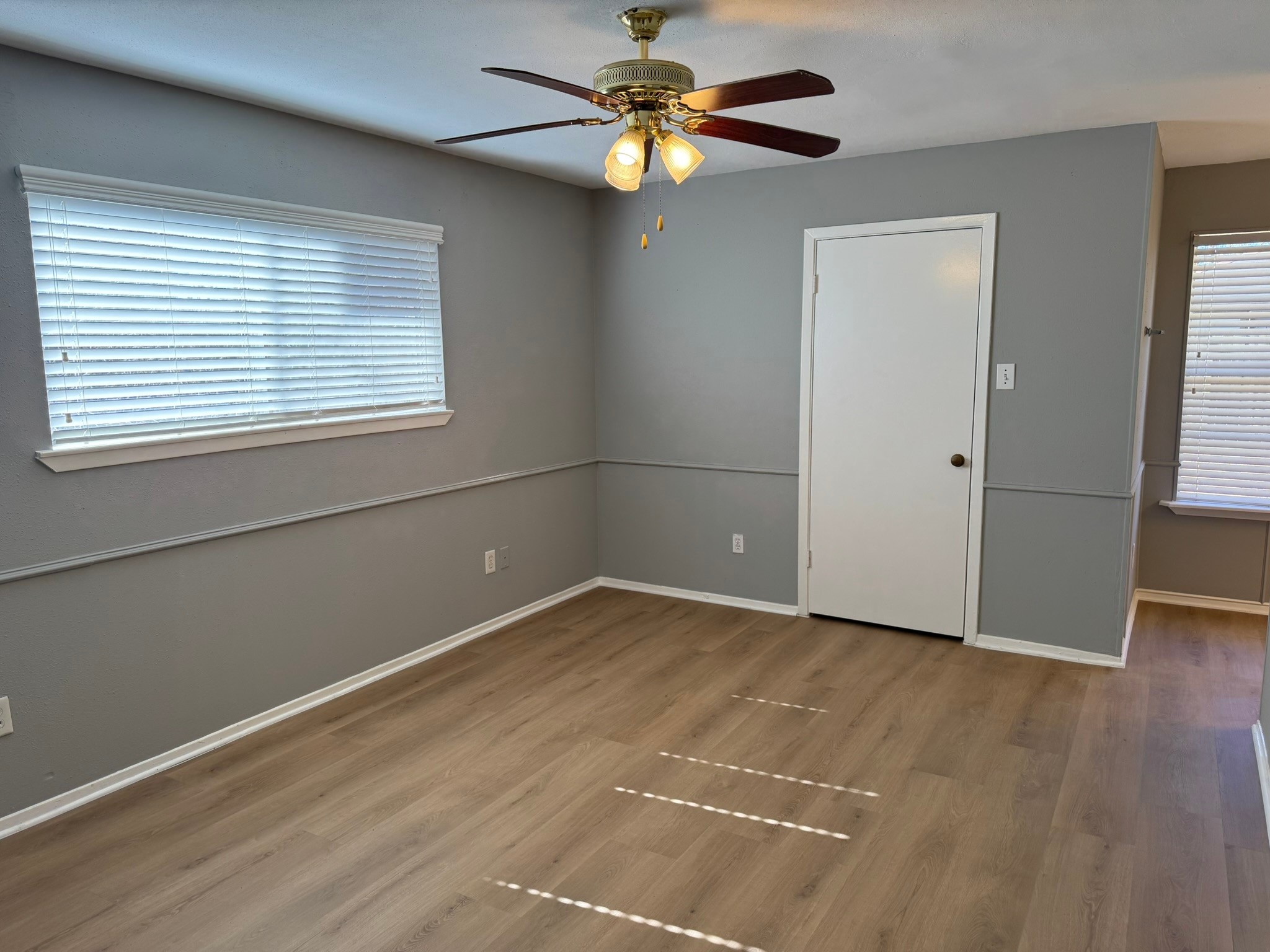7231 Daylight Lane Houston, TX 77095 - Photo 6 of 11 a view of an empty room with window and wooden floor