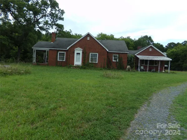 a front view of a house with yard
