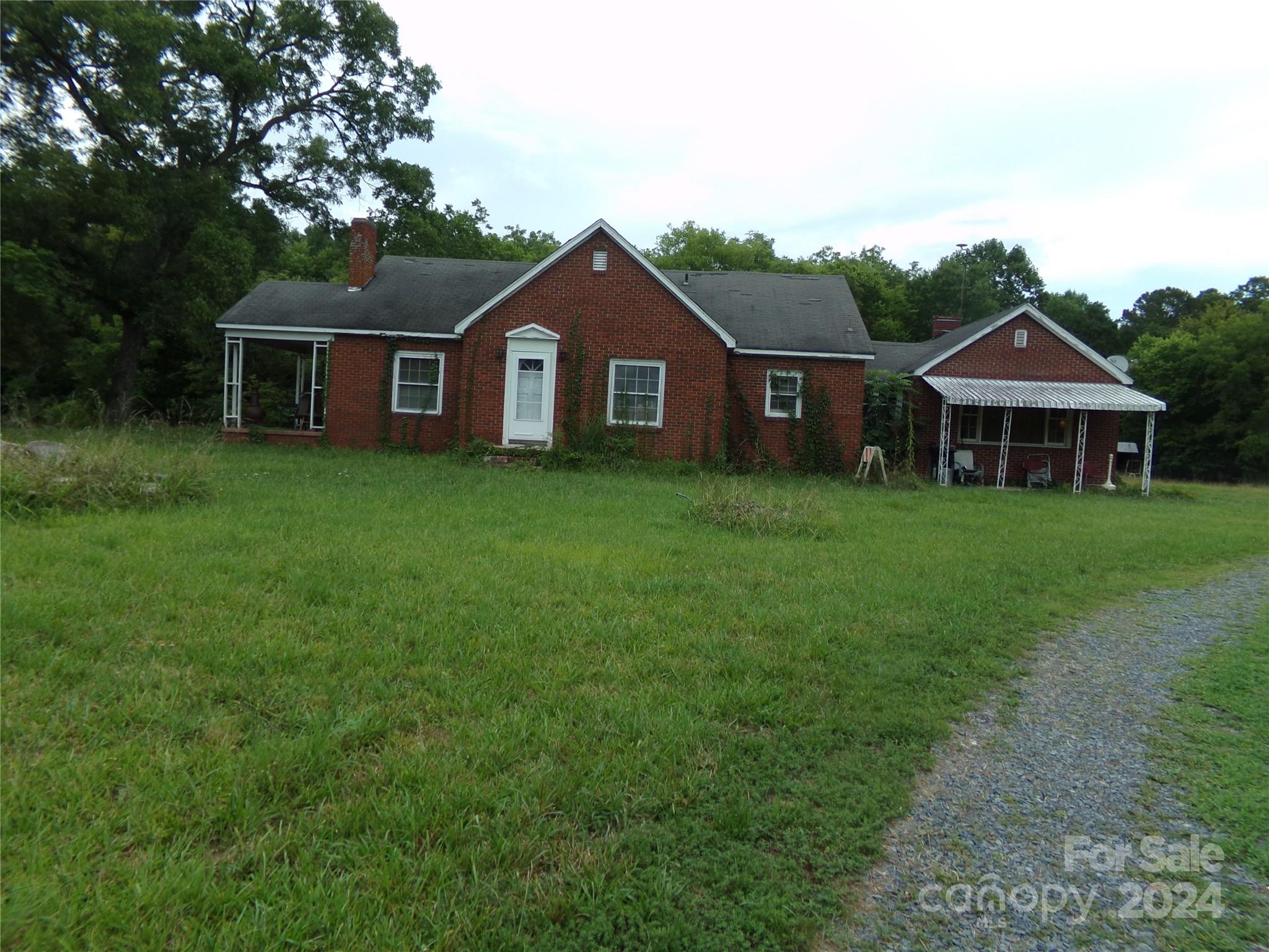 14004 Elm Street Stanfield, NC 28163 - Photo 2 of 4 a front view of a house with yard