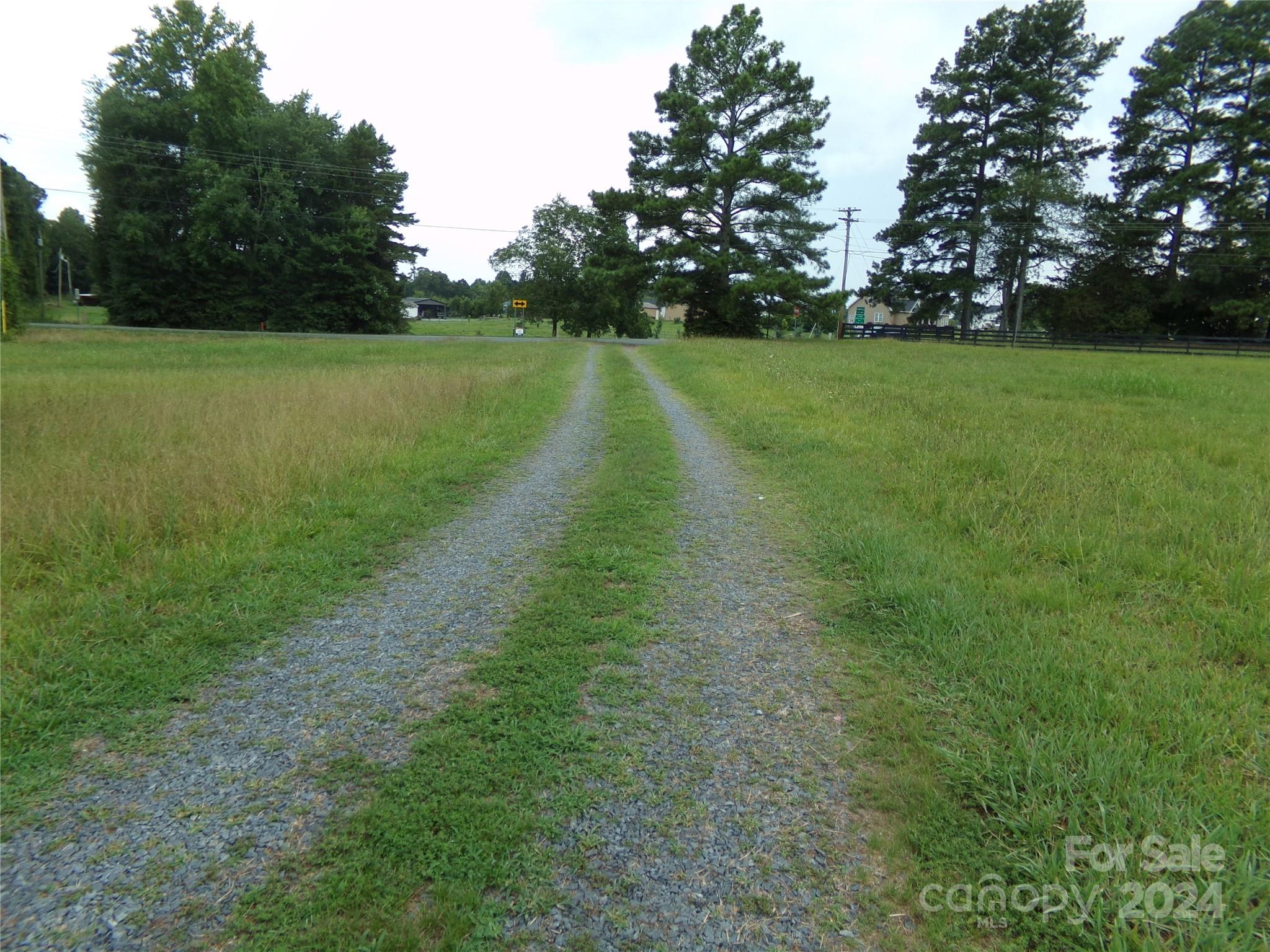 14004 Elm Street Stanfield, NC 28163 - Photo 4 of 4 a view of a golf course with a lake