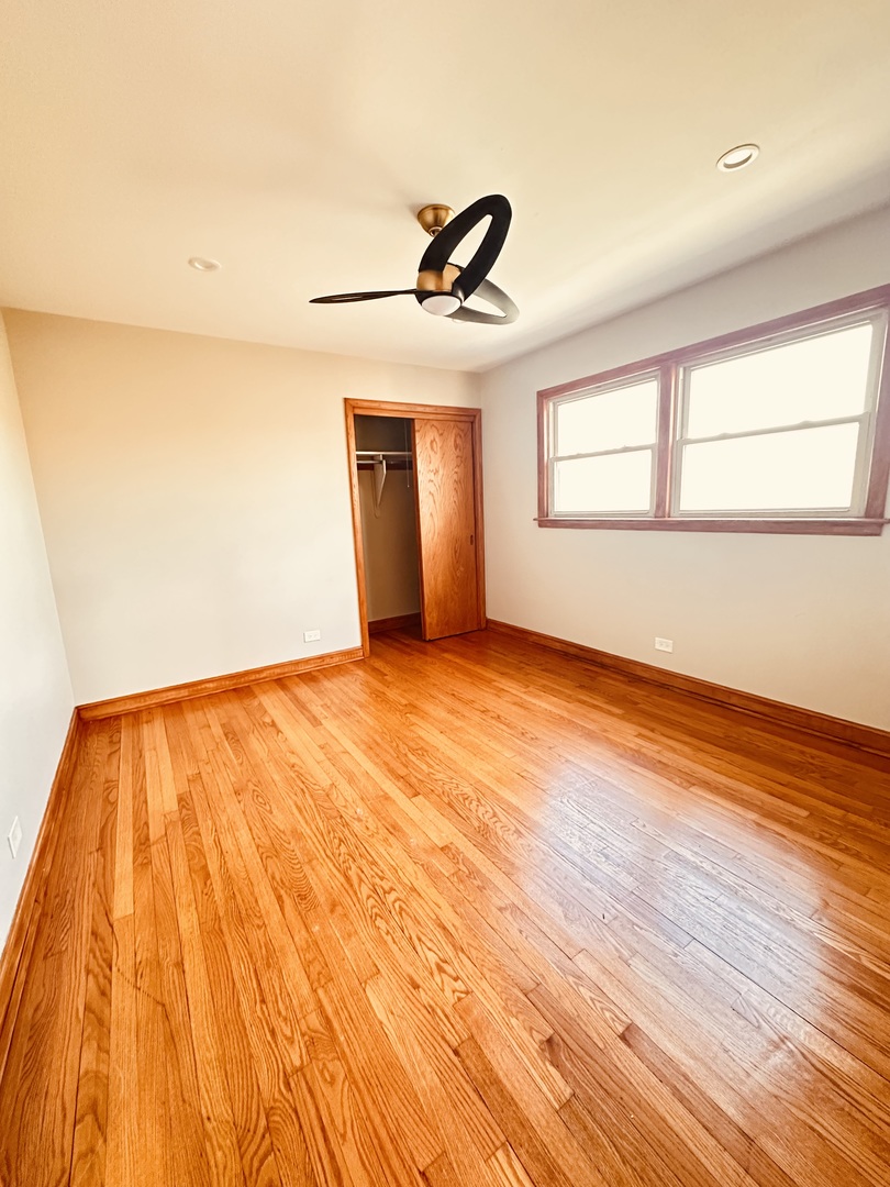 2823 West 71st Street Chicago, IL 60629 - Photo 11 of 18 wooden floor in an empty room with a window