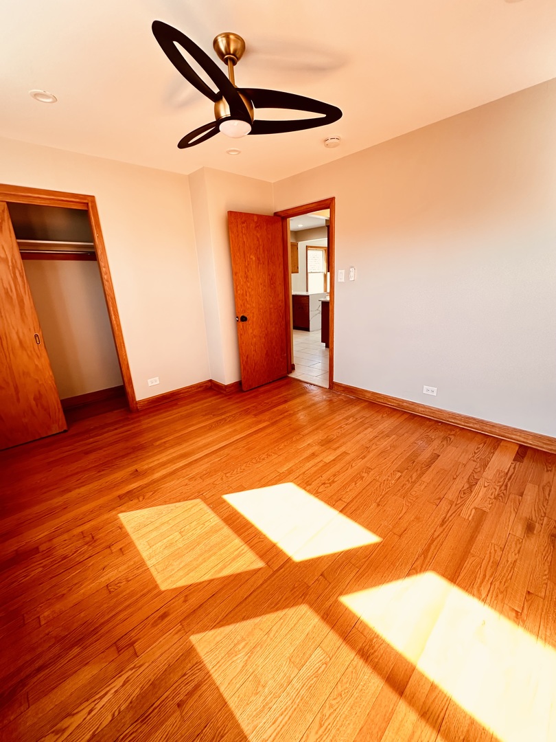 2823 West 71st Street Chicago, IL 60629 - Photo 15 of 18 a view of a room with wooden floor