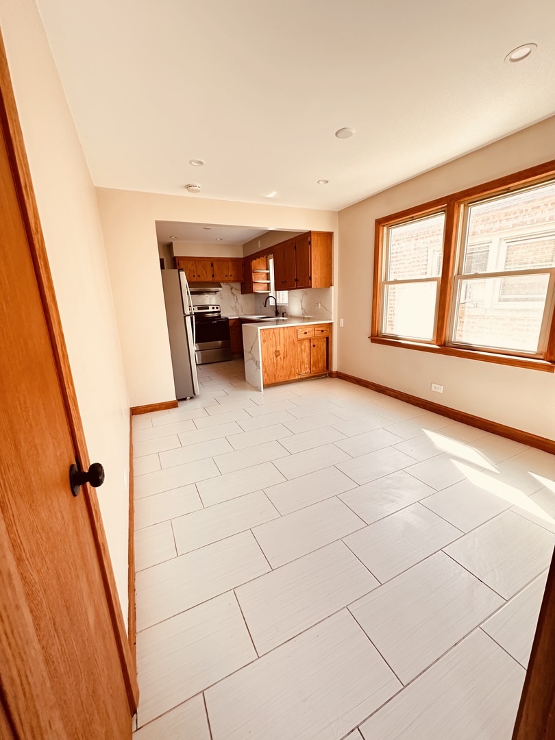 2823 West 71st Street Chicago, IL 60629 - Photo 4 of 18 a view of an empty room with a window