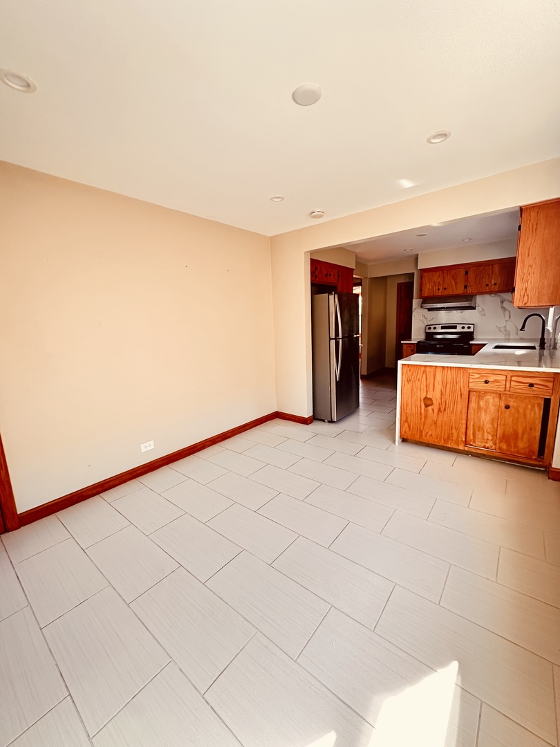 2823 West 71st Street Chicago, IL 60629 - Photo 5 of 18 a view of furniture and refrigerator in a room
