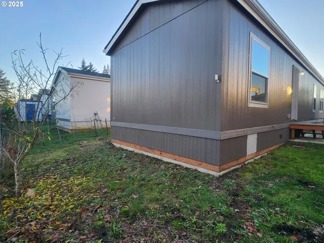 a backyard of a house with lots of green space