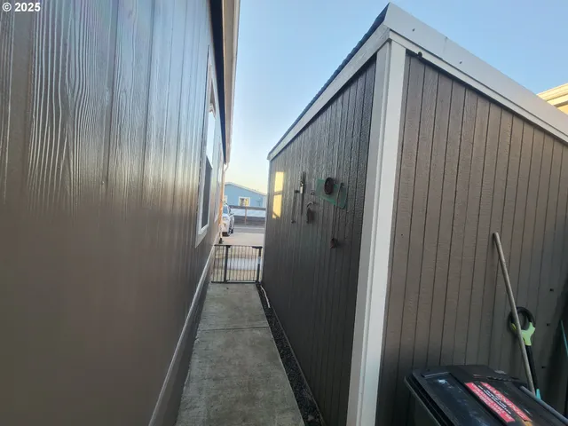 a view of hallway with wooden wall