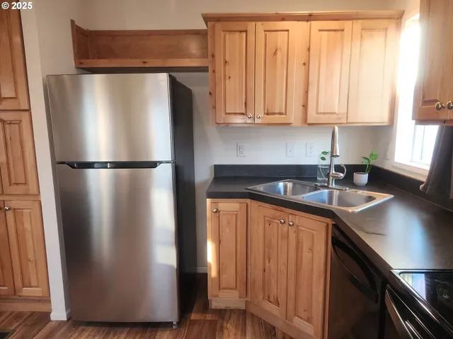 a white refrigerator freezer sitting in a kitchen