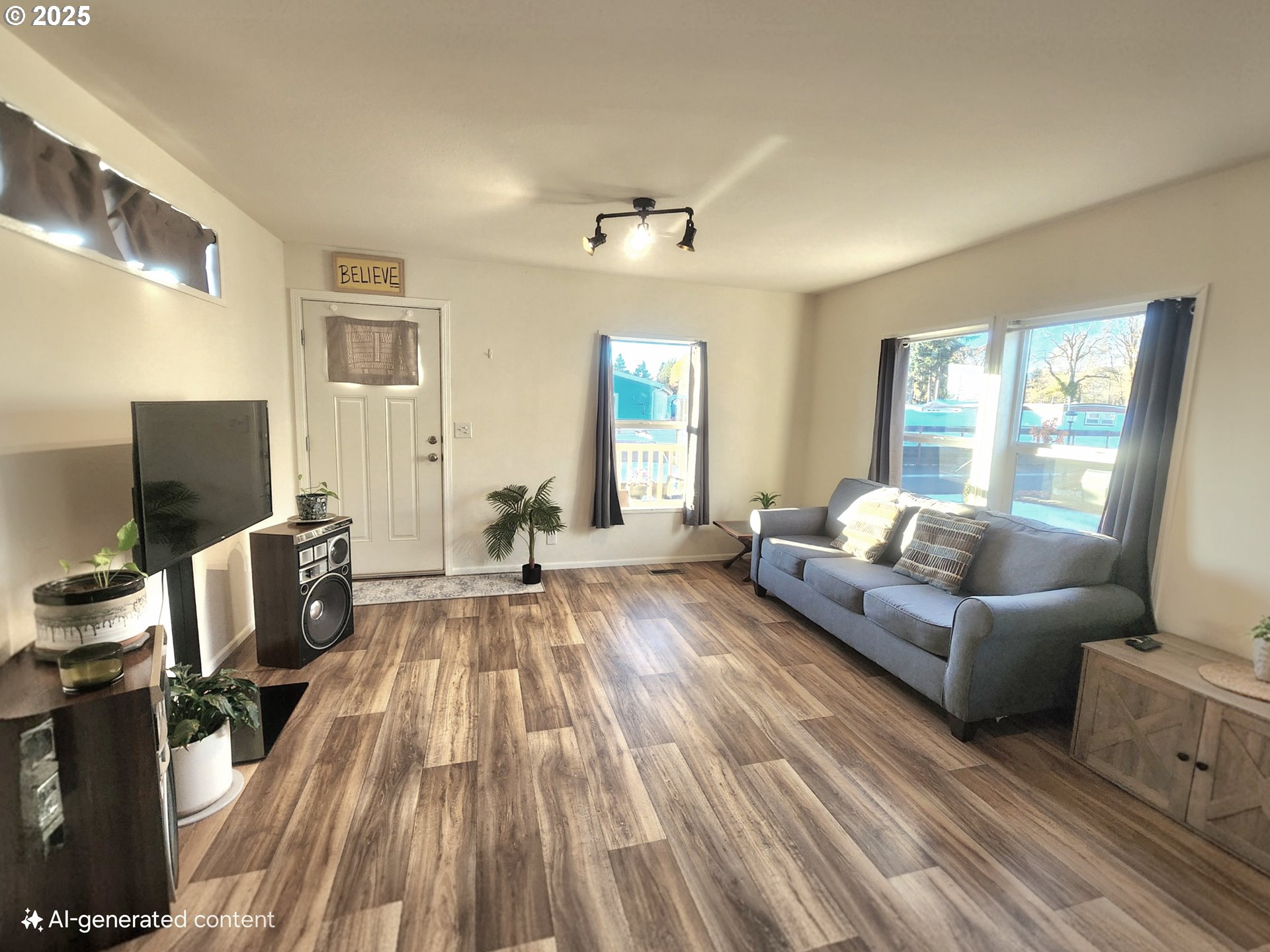 515 Southeast Sheridan Road, Unit 6 Sheridan, OR 97378 - Photo 10 of 30 a living room with furniture and a flat screen tv