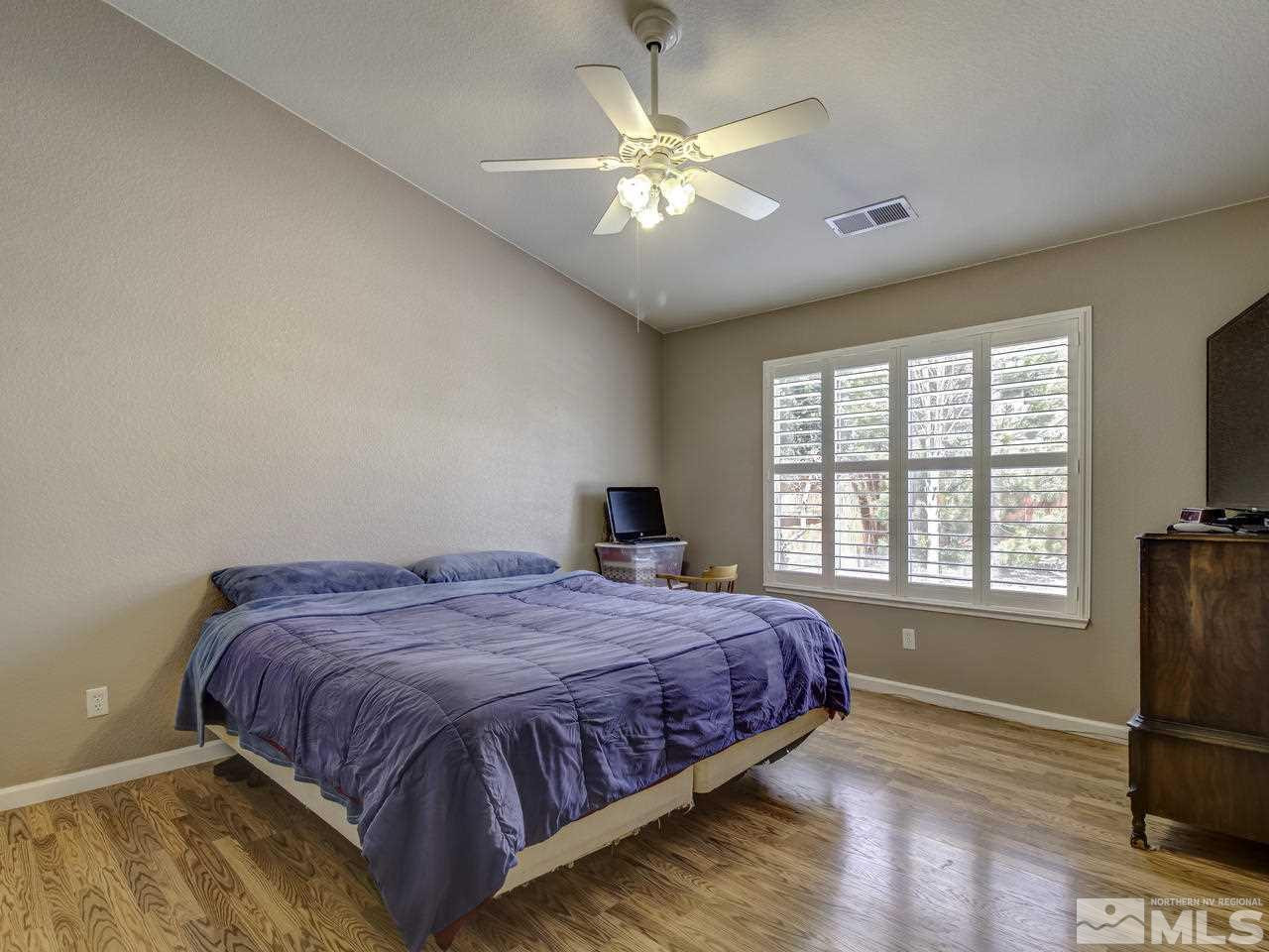 1789 River Gorge Drive Reno, NV 89521 - Photo 12 of 24 a bedroom with a bed dresser and a window
