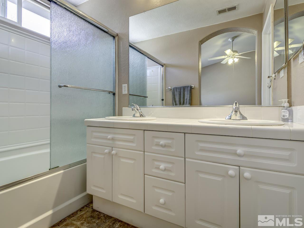 1789 River Gorge Drive Reno, NV 89521 - Photo 14 of 24 a bathroom with a sink and a mirror
