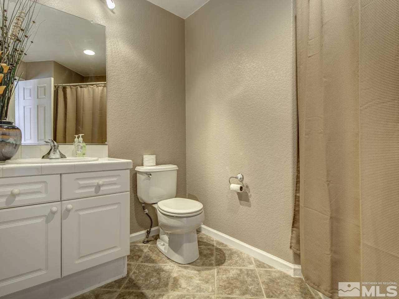 1789 River Gorge Drive Reno, NV 89521 - Photo 18 of 24 a bathroom with a sink toilet and vanity