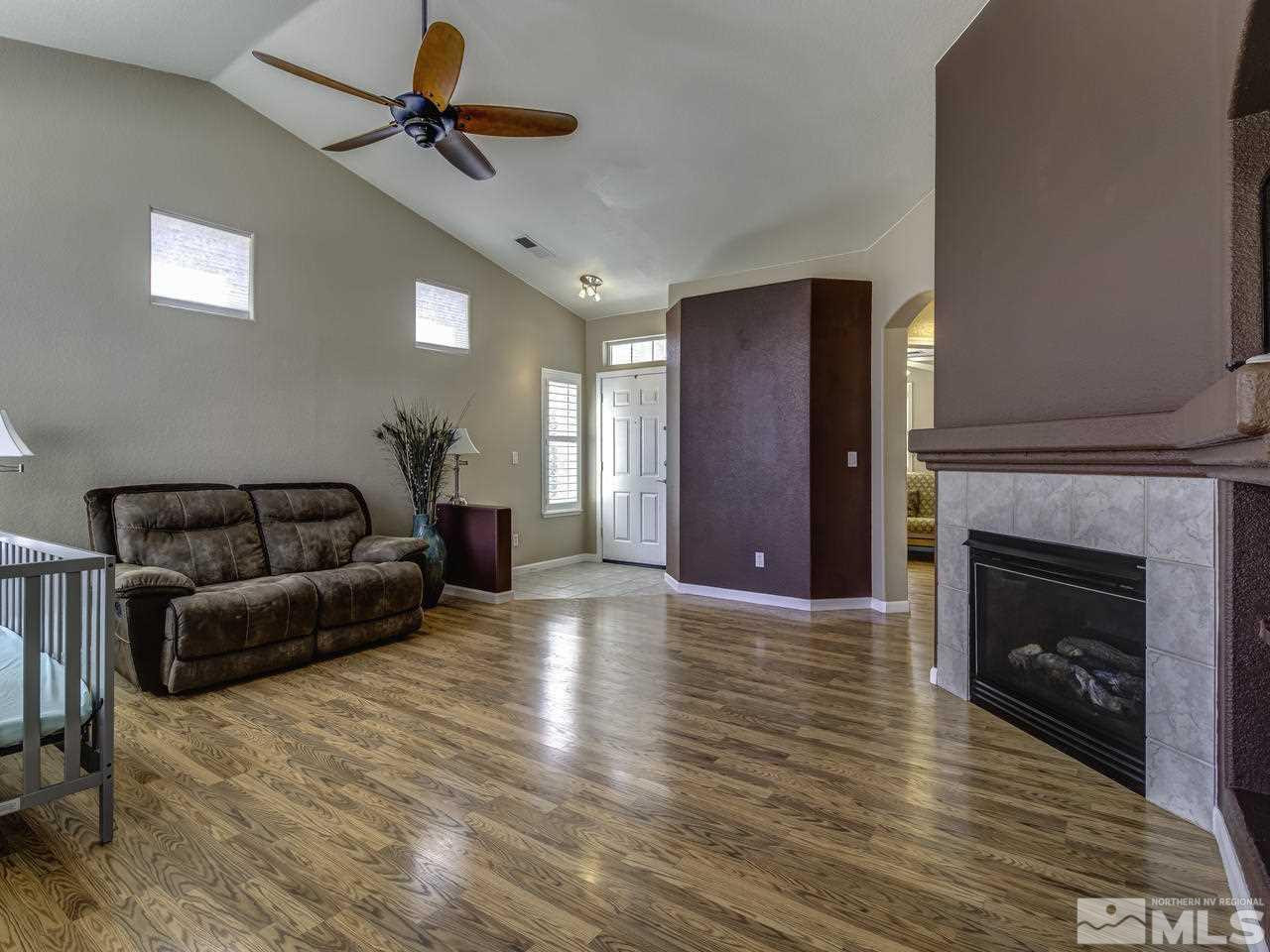 1789 River Gorge Drive Reno, NV 89521 - Photo 4 of 24 a living room with furniture and a fireplace