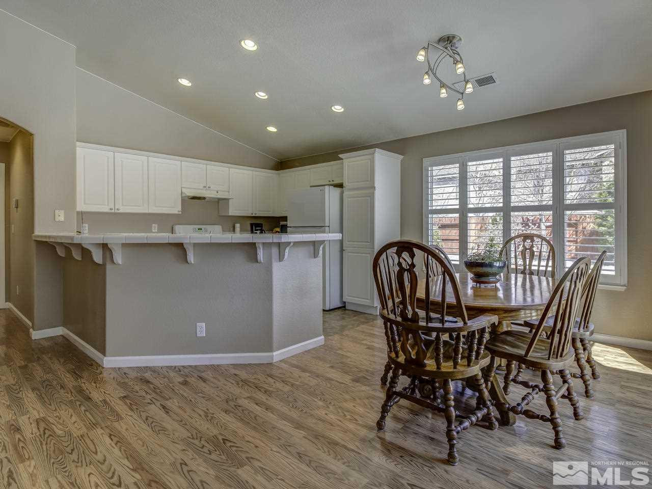 1789 River Gorge Drive Reno, NV 89521 - Photo 6 of 24 a view of a dining room with furniture window and wooden floor