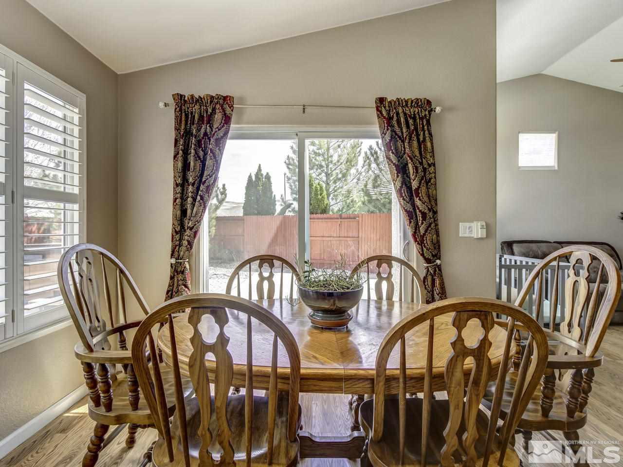 1789 River Gorge Drive Reno, NV 89521 - Photo 10 of 24 a view of a dining room with furniture window and outside view