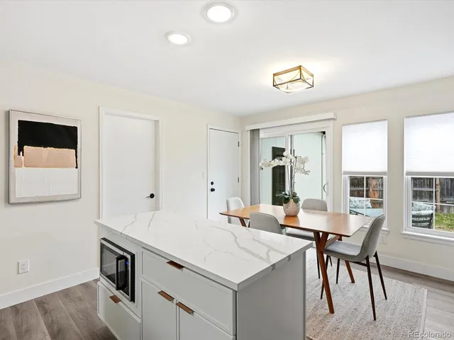 a view of a dining room with furniture and window