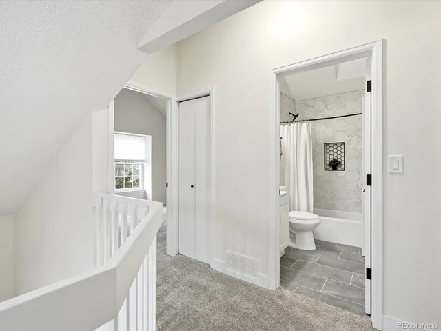 a bathroom with a toilet and a sink