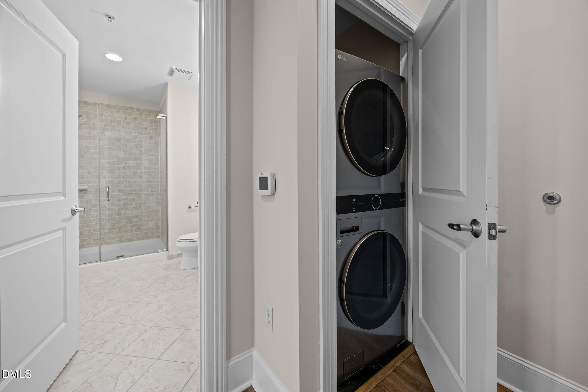400 West North Street, Unit 814 Raleigh, NC 27603 - Photo 11 of 41 a view of a hallway with washer and dryer