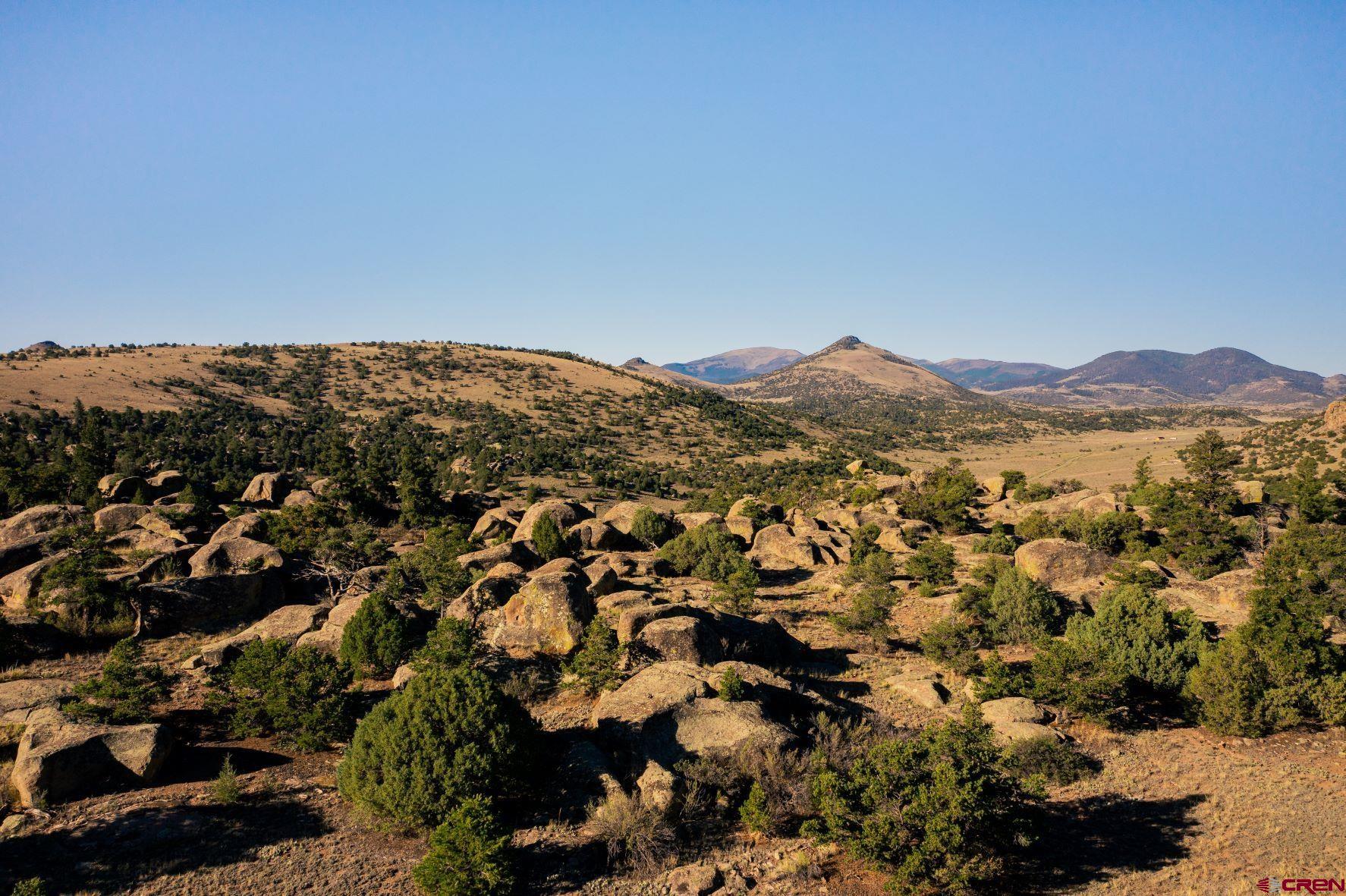 an aerial view of mountain and lake view