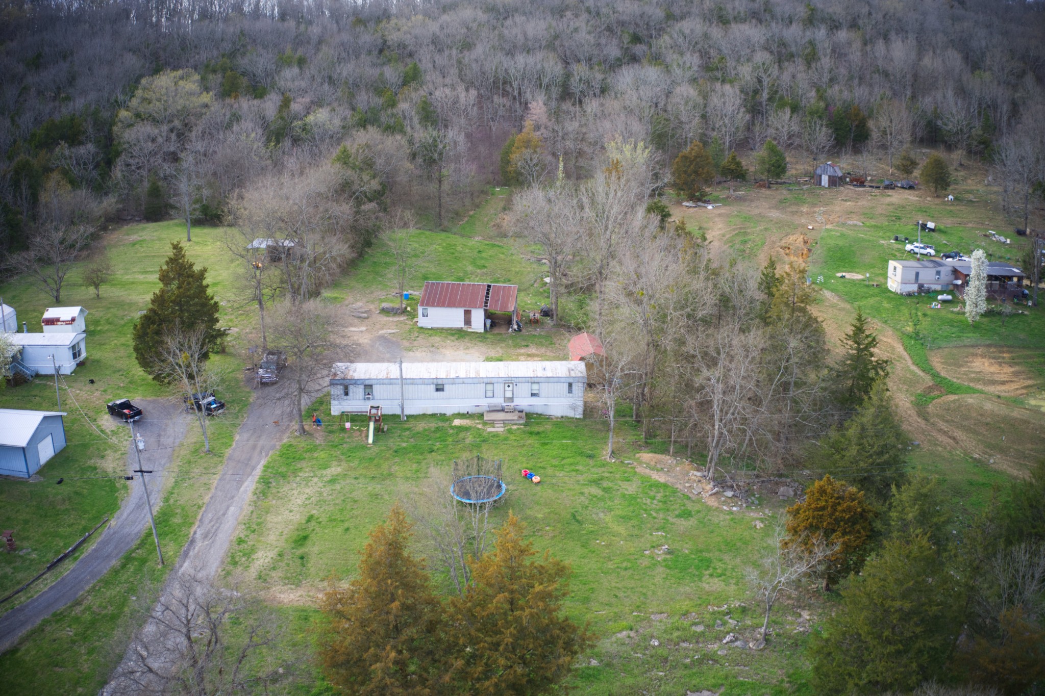 163 Wilburn Hollow Road Riddleton, TN 37151 - Photo 1 of 10 a backyard of a house with a yard and outdoor seating