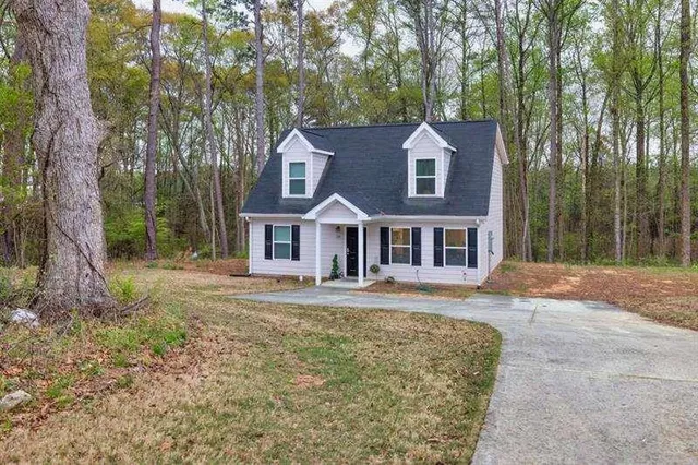 front view of a house with a yard