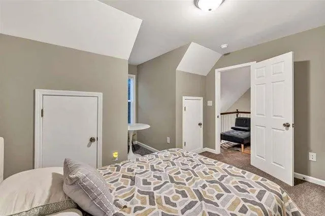 a bedroom with a bed and a couch