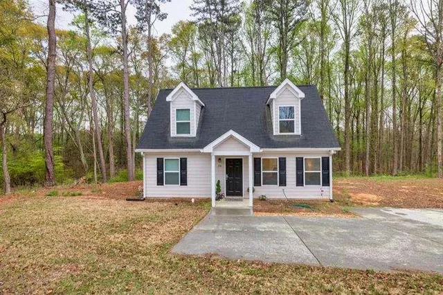 front view of a house with a yard