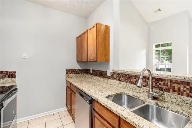 a kitchen with a sink and a window