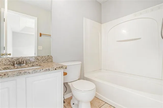 a bathroom with a sink a toilet and a bathtub