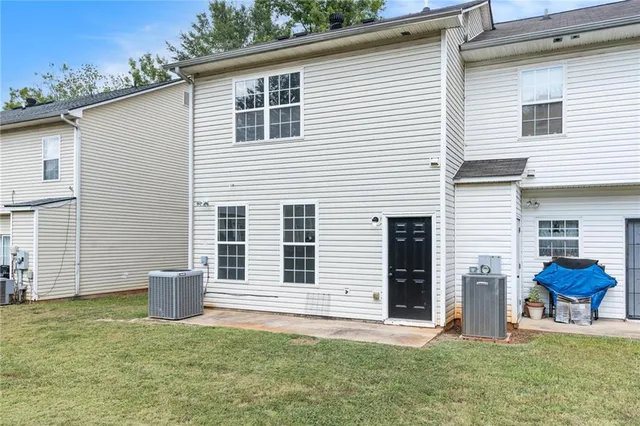 a backyard of a house with seating space