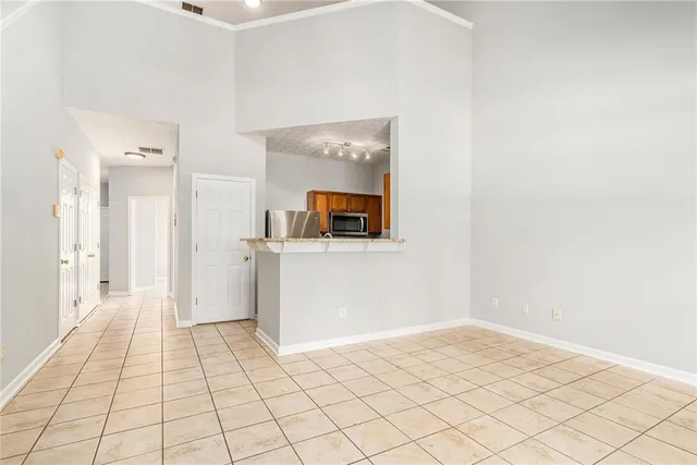 a view of a room with wooden floor and cabinet