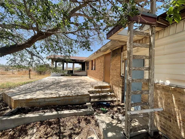 a view of a terrace with wooden fence