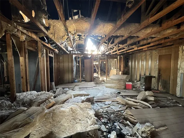 a view of a street with a building in the background