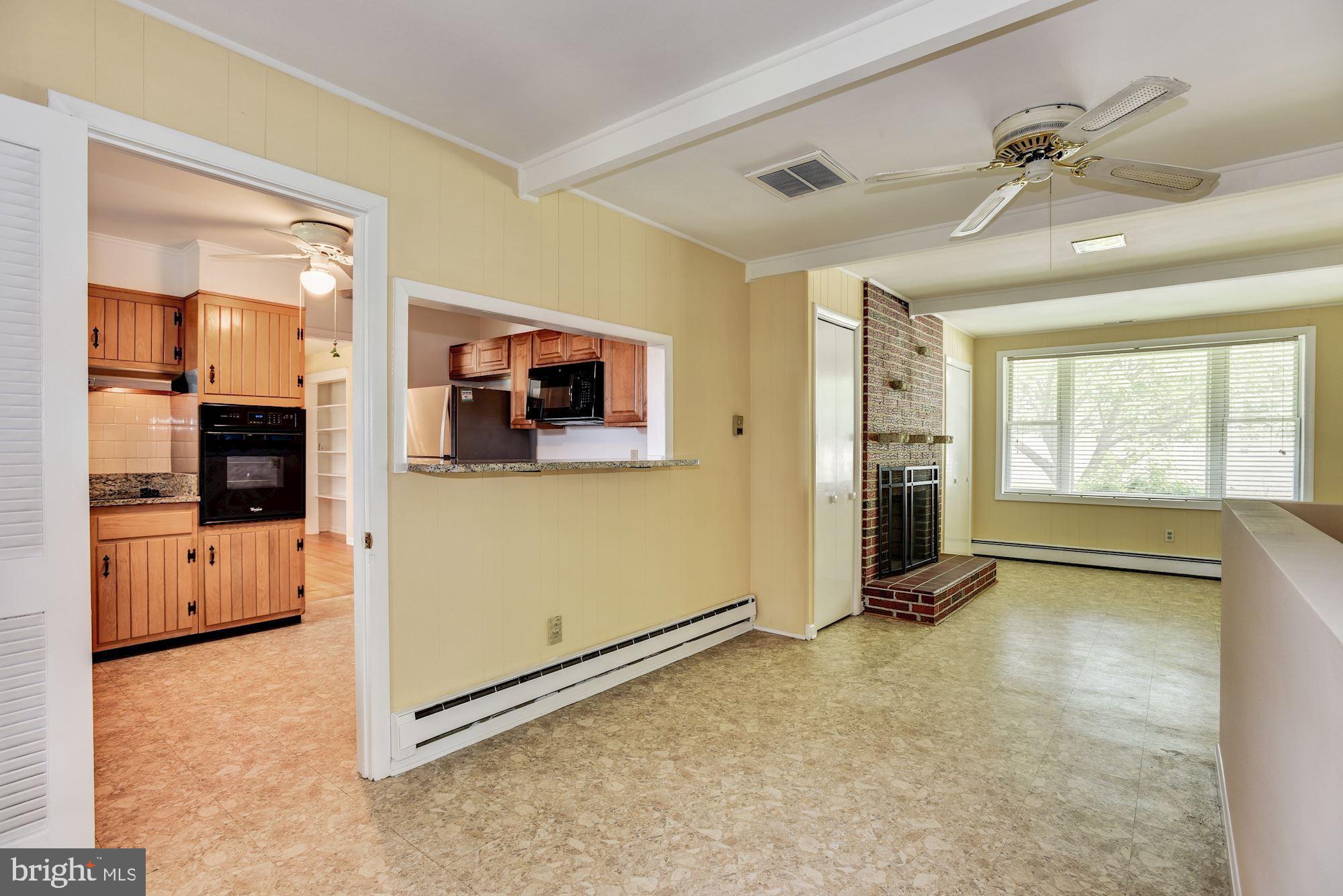 8492 Laurel Road Pasadena, MD 21122 - Photo 12 of 46 a view of a livingroom with an empty space and a window